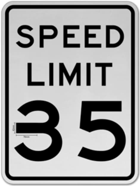 O sinal de velocidade de 35 MPH com um pedaço de 5 centímetros de fita isolante no "3"